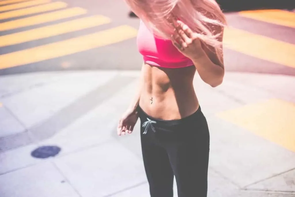 Woman with toned stomach after LA-EMS Body Sculpting Treatment Bury